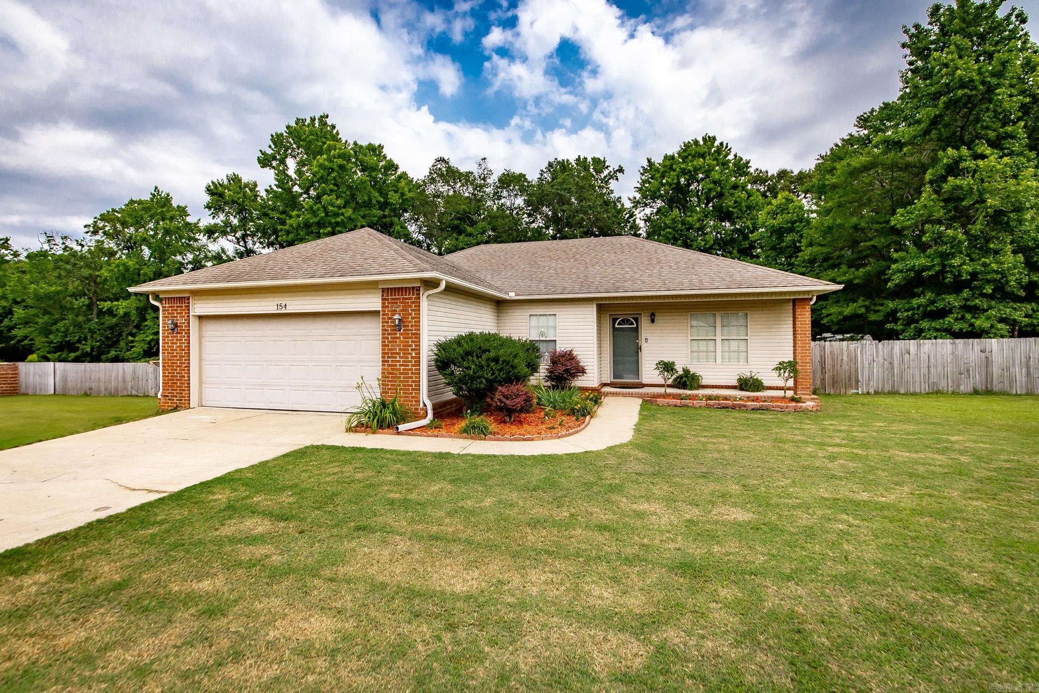Discover your peaceful retreat in Lonoke County, located in the highly sought-after Cabot School District! This charming 3-bedroom, 2-bath home offers the perfect blend of country living and town convenience. Situated on a spacious 0.86-acre lot, you'll love the expansive fenced backyard and the inviting deck, ideal for relaxation or entertaining. Enjoy picturesque views of the pond directly behind the property, enhancing that serene, country feel. Inside, the home has been enhanced with new paint in various areas, ready for you to move right in. For your safety and peace of mind, there's also a convenient in-ground storm shelter located in the garage. Ready to make this peaceful country home yours? Contact us today to learn more or schedule a viewing! SqFt approx measuring encouraged, (see agent remarks)
