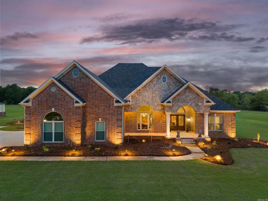 Stunning executive estate with custom saltwater pool, 2,400 square foot shop, pond, and over 17 acres. Open concept living area/kitchen. Chef's kitchen with beautiful granite countertops, custom backsplash, extra convection oven, ice maker, and large island with prep sink. Separate formal dining room and sitting area. The spacious primary suite features an amazing bathroom with a custom tile shower, electric fireplace, jetted tub, re-circulating hot water, and an oversized designer closet.  Split floor plan with 3 other bedrooms downstairs, one with an ensuite bathroom that doubles as the pool bathroom. Dedicated office that is not counted as a bedroom. Upstairs is an amazing hangout space. Bonus/game room with large bar and wine fridge. Beyond the bonus/game room is a media room that is perfect for watching big games and blockbuster movies with theater seating that conveys. There is a 5th bedroom and full bath upstairs as well. Outside features a custom saltwater pool with tanning deck, water feature, and hot tub. Covered patio with wood-burning fireplace. 60 solar panels, discreetly located on top of shop and not house, keep electric bills low. Geo-Thermal HVAC. Roof 2022.