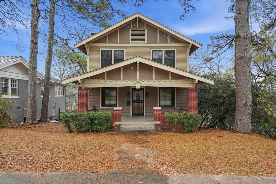 129 Thayer isn’t just a house — it’s a piece of 1916 craftsmanship waiting for someone with vision to bring it back to life. Perched on a generous corner lot in the heart of charming Capitol View, this historic Craftsman is surrounded by beautiful architecture and a neighborhood full of character. The inviting front porch, soaring ceilings, and large windows that pour in natural light set the stage for something truly special.  Inside, you’ll find the irreplaceable details that make these homes so beloved: original hardwoods with a century of stories beneath them, a spacious living room meant for connection, and a dining room ready to host new memories. With historic tax credit eligibility, the restoration you imagine becomes that much more attainable — preserving the charm while enhancing the function.  Being sold as-is, where-is, this home is ready for someone who loves historic homes to roll up their sleeves, honor its heritage, and enjoy the rewarding journey of restoration. A timeless home and a chance to create something truly yours — welcome to 129 Thayer.