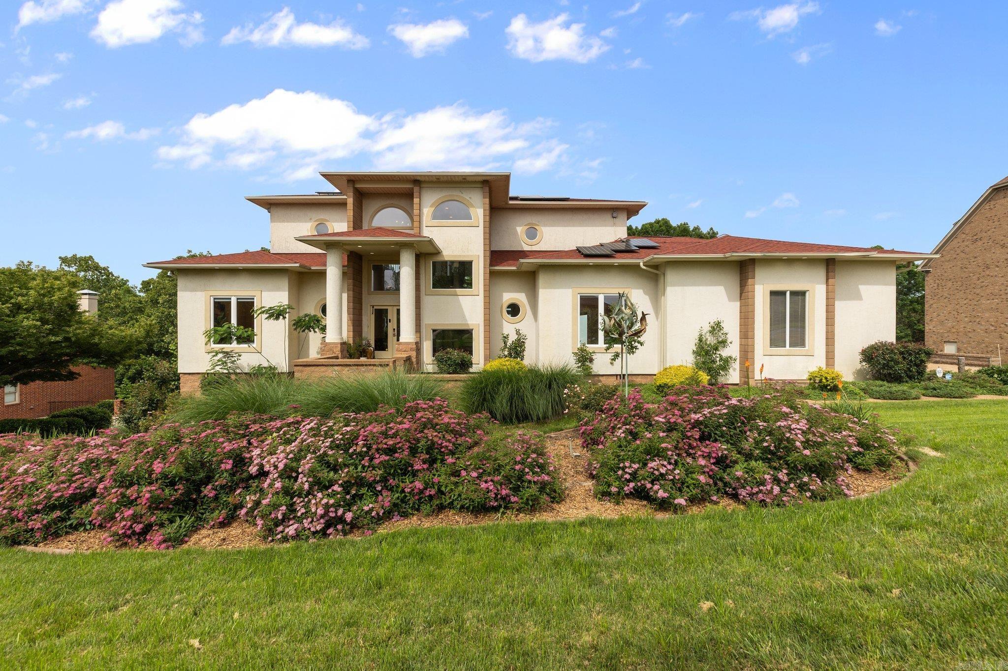This incredible Spanish style property sits on the highest view point of Little Rock with the most remarkable scenery. Seller will most miss separate balconies on each level perfect for enjoying over an acre of beautiful landscaping and perfect for entertaining. This property features a fully owned Solar Panel system and a backup generator with automatic switch. The unfinished basement has been converted to a wood shop dust collection. Both the main living area and primary suite have fireplaces for the home owners' enjoyment and the garage has a converted electric car hook up. The garden features fruit trees including peach, pears, apples, figs grapes and plums and there is a separate fenced in area for pets or contained back yard use. Don't miss all of the updates on this one of a kind home.