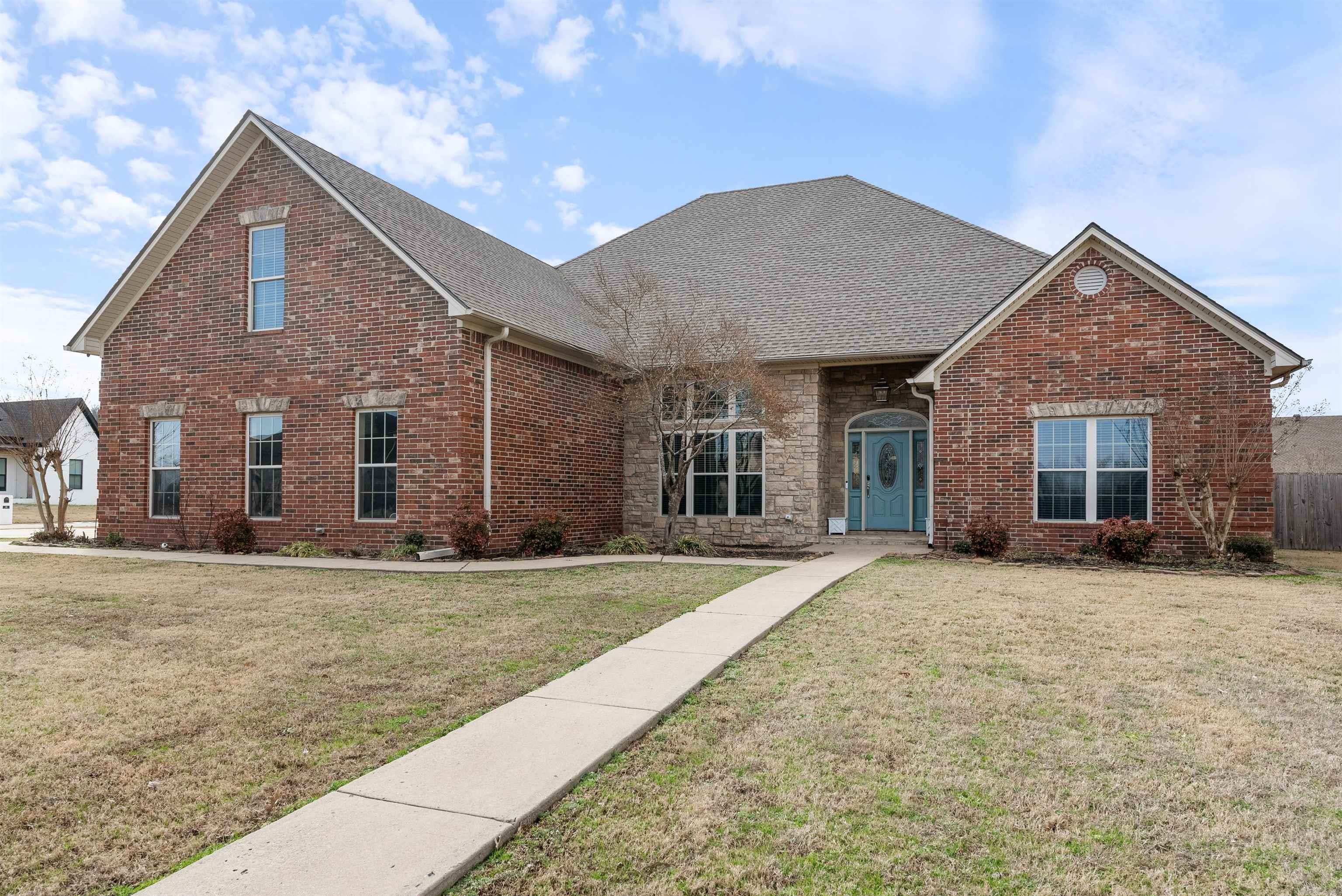 This stunning 5 bedroom 3.5 bath home has plenty to offer everyone in the family! Sitting on almost half an acre corner lot in Quail Hollow, you will find an amazing great room with a vaulted wood ceiling, a huge rock fireplace and custom built-ins. There is a formal dining with beautiful windows, an absolutely charming eat in kitchen with brick floors, a gas cooktop, double ovens, island and breakfast bar. The spacious master has double tray ceiling, his and her closets, jetted tub and separate shower. There are 3 other bedrooms downstairs with jack and Jill bath. Upstairs you will find a loft area perfect for hanging out, a bedroom, an office/flex room and a full bath. There is also an amazing game room/ theatre room with separate access and plenty of space for game nights. Extra driveway provides parking for guests, or even an RV. NEW ROOF December 2024!!!