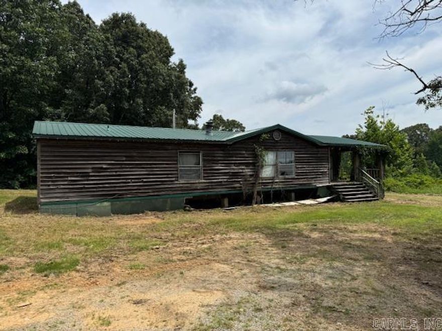 1716 MH ON 3 ACRES M/L.  2000 mobile home needs rehabbed. 3 bedrooms, 2 bathrooms with 1716 square feet. 2.70 acres has well, septic and electric per owner. Property was a rental, selling “As-Is”. Land has a good building spot! Private! Taxes $257 per year. Clay County Connect Fiber Optic Internet available!