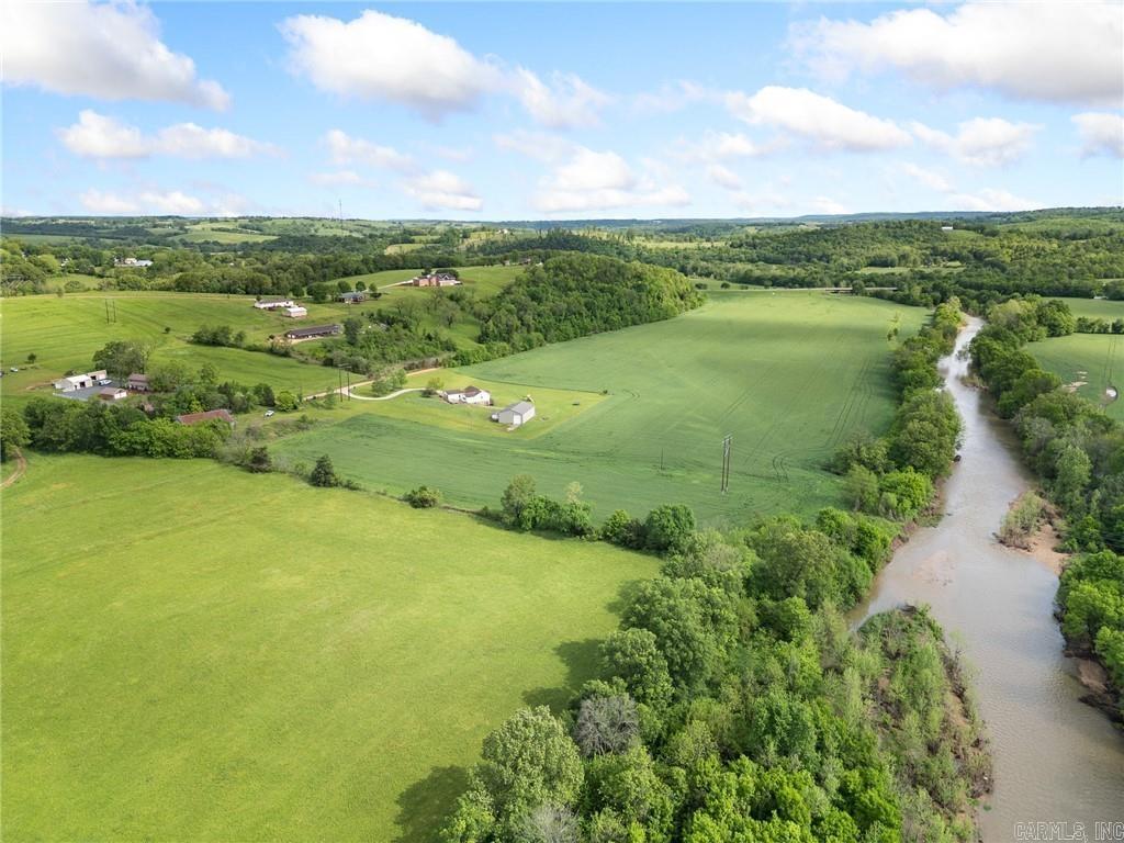 Looking for farmland?? Here it is!!! 119.5 ac m/l just outside of Alpena, AR, two tracts, both have Long Creek frontage. The property is currently producing income by being planted in wheat, followed by soybeans, but could easily be used as hay fields or cattle grazing. The tract off of US 412 has a 65 x 60 equipment barn equipped with electric and water. This farm is well-maintained and ready for its next owner and their business venture.