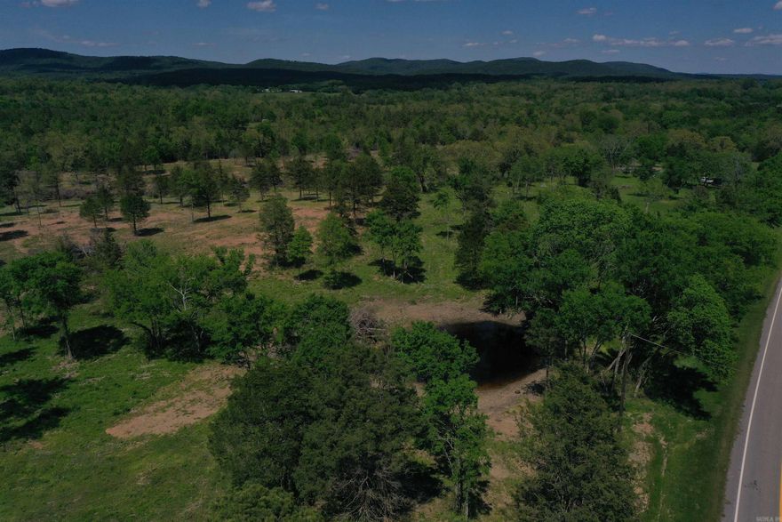 As you pull in the driveway to this 12 +/- acres, you will immediately see the picture-perfect build site atop a grass covered hill, overlooking the highway in front, and the park-like pasture and timberland in the back of the property. There is a shed and water well in place at the build site, and power is available at the highway. Along with being a beautiful build site, this property has an excellent location as well. Dragover Recreation area on the Ouachita River is just a few minutes’ drive down the county road, providing access to one of the most unique canoeing and fishing opportunities on the river. This section of the river offers a multiple hour float, that ends within walking distance of the parking area! The Ouachita National Forest is just minutes away as well, offering hundreds of thousands of acres of public land, with many great opportunities for hunting, fishing, hiking, and enjoying The Natural State. If you enjoy spending time on the lake, an access and boat ramp for Arkansas largest lake, Lake Ouachita, is just 15 minutes away.