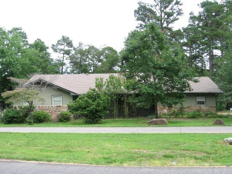 GOLF COURSE HOME NEEDS SOME TLC!!!  On a large corner lot on the Indian Hills Golf Course, #13 green.  The replatted lots are .48 acre.  The house is almost 2000 sq ft with 3BR, 2 Ba.  Living room is spacious and has a fireplace.  Dining area adjoins kitchen. Kitchen is updated with nice wood cabinets, backsplash, & all appliances are included.  A nice office/den is on the back of the home with a golf course view, with a shop/storage area underneath it.  Enter from the back through a sunroom.  Lots of storage too.  There's a wrap-around deck on the back that overlooks the golf course.  The yard is partially fenced.  A large 2-car garage has space for a shop and tons of storage!!  Yard has nice landscaping with flowering shrubs & trees.  Come take a look.  Agent Remarks