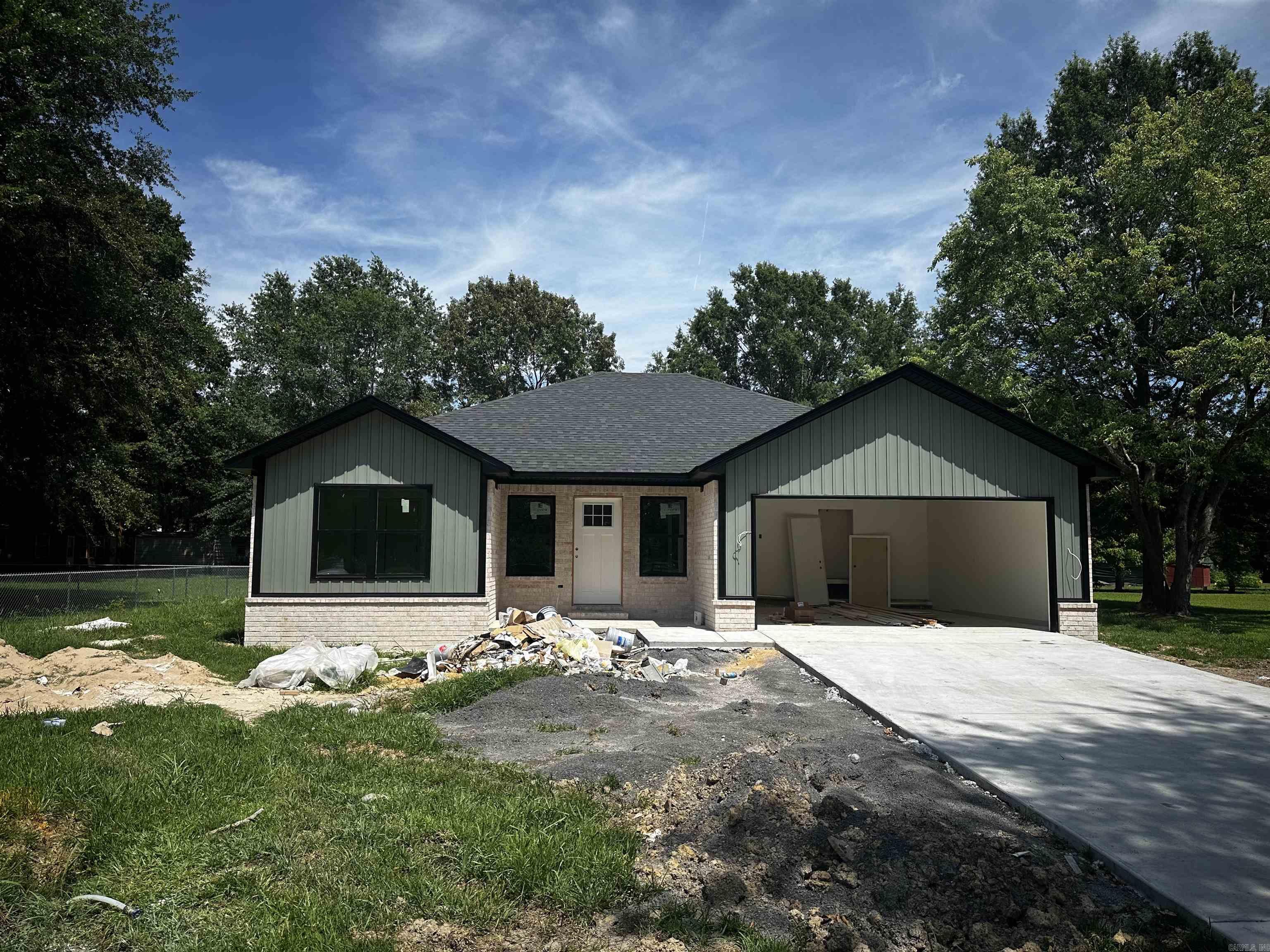 Expected completion date: Mid August. Brand new custom-built home on a spacious 0.36-acre lot, priced at $235,000! This 3 bed, 2 bath home offers 1,340 sq ft of quality craftsmanship featuring quartz countertops, custom cabinetry, and tiled showers in both the master and guest bathrooms. Luxury vinyl plank flooring runs throughout the entire home, including the spacious laundry room. The open-concept layout, two-car garage, and covered back patio make this home perfect for both comfortable living and entertaining. Nestled in a quiet neighborhood with mature treesādonāt miss this one!