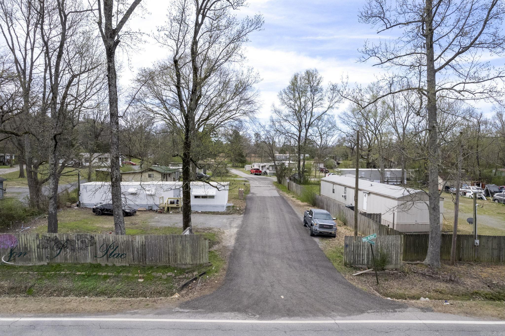 14 pads, 6 mobile homes and 2 houses convey. The property also has a barn, shop, office and additional undeveloped land. Fully fenced.