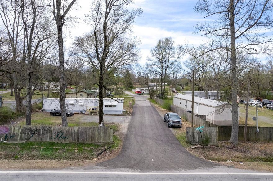 14 pads, 6 mobile homes and 2 houses convey. The property also has a barn, shop, office and additional undeveloped land. Fully fenced.