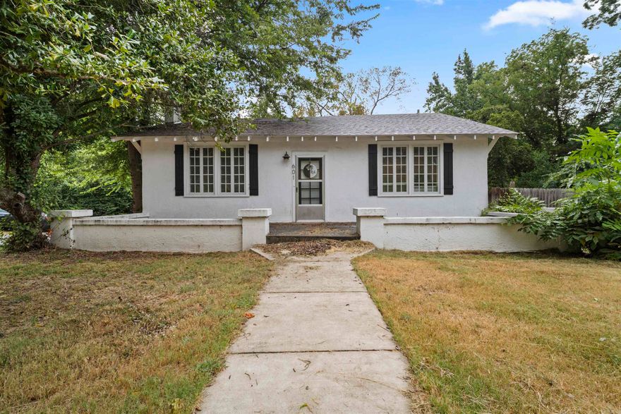 Charming 2 bed 1 bath home near downtown Morrilton. This home is full of character and modern touches! Situated on a spacious corner lot, it features a large fenced-in back yard. It's perfect for pets, playing or entertaining! Inside you will find a cozy painted brick fireplace with gas logs, creating the ideal spot for relaxing evenings. The kitchen features butcher block countertops, shaker-style cabinets, and stainless-steel appliances. The bathroom was remodeled as well as the exterior of the home painted in 2021. With plenty of windows that fill the home with natural light, you'll enjoy a bright and welcoming atmosphere throughout! *Agents see agent remarks*