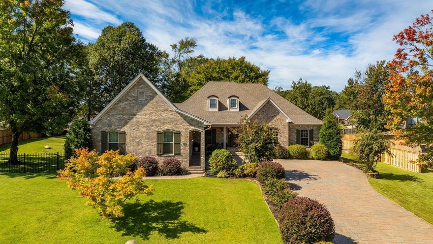 This stunning home in Hurricane Lake Estates blends elegance, comfort, thoughtful updates, and a wonderful lake view. A stamped driveway and manicured landscaping set the tone, while inside, 10-foot ceilings, new LVP floors, a charming stone fireplace with a brand-new mantle, and a formal dining room create an inviting atmosphere for everyday living or entertaining. Designed to live like a one-level, the main floor features a spacious primary suite complete with an office, laundry, and living area, along with three additional bedrooms. Upstairs, a bonus playroom offers flexible space for work or play. The garage and 8x10 shop feature sleek epoxy floors, with recent improvements including a bonus room, new HVAC, hot water heater, and a full house generator. Outdoors, the oversized backyard offers a private retreat with a shaded back porch, mature trees, and a fully fenced yard with wrought iron accents in front and wood fencing along the sides and rear. Truly a rare find you won’t want to miss!