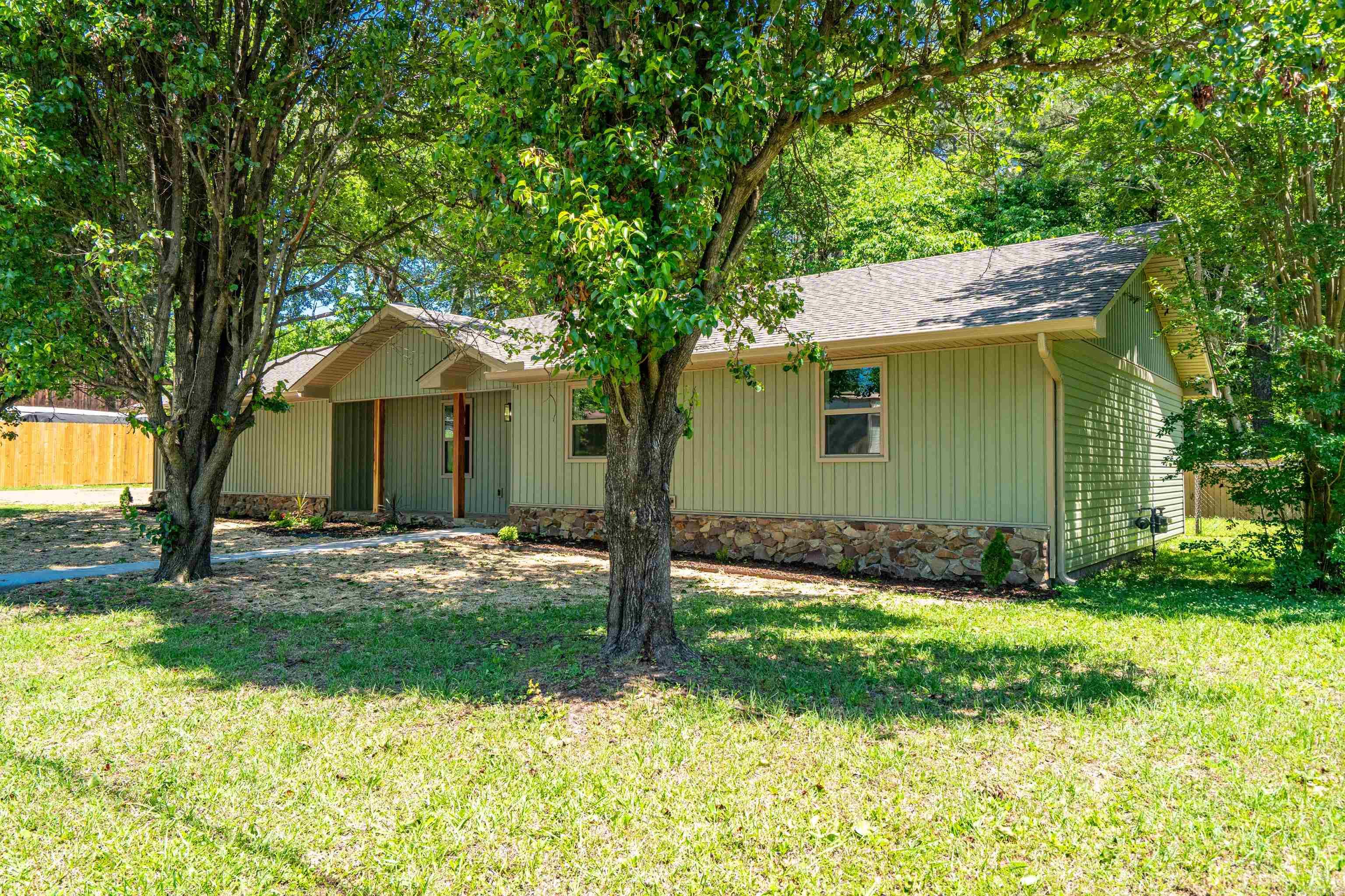 2025 Remodel: 3 bed, 2 bath home with new roof, windows, appliances, flooring, siding, gutters, light fixtures, ceiling fans, new garage door, water heater, and more. Very nice tile shower in primary bedroom, custom closets, new wood fence, and a landscaped yard with shade trees in the front. Convenient locationāmust see!