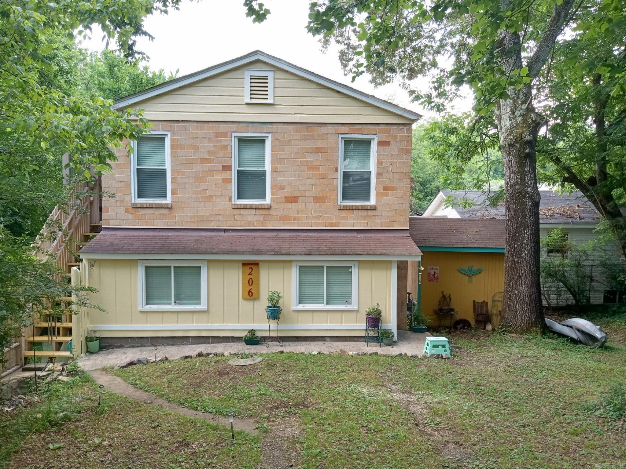 Do you want to live in a treehouse? Check out this one of a kind, well maintained home! It has a screened-in balcony, treetop views, outdoor storage, is walking distance from the Pullman trailhead and in a prime location for visiting downtown hot springs - while also providing tons of quiet privacy. The house is very close to Rick's Pond, DeSoto Park, Gulpha Gorge and so much more! It has a newer roof, updated plumbing, new electrical panel and other items were serviced recently such as the hot water heater, dryer, roof vent and faucets. This is a highly motivated seller. Bring all offers! The trees have been trimmed and it's ready for you to move in! All of the appliances convey.