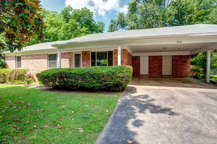 Immaculate Starter Home.  Open updated kitchen, new stainless appliances, concrete counter tops, water filter, and tile floor. Open living area, refinished original hardwood floors, master bedroom & bathroom plus 2 additional bedrooms and a guest bathroom. Large fenced in yard, back patio, front porch and 2 car carport.