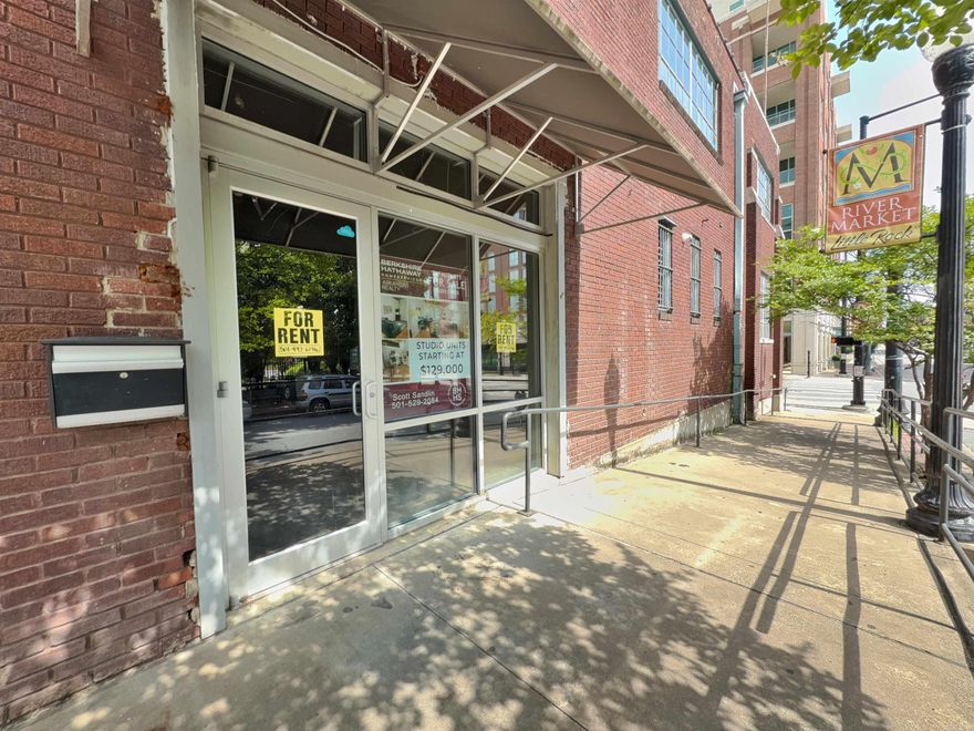 PRIME DOWNTOWN LOCATION Step into the vibrant energy of downtown with this rare opportunity. Located in the iconic Tuf Nut Lofts—formerly home to the legendary blue jean factory. Now officially listed on the National Historic Register, the building showcases post and beam construction, soaring 15-foot ceilings, and exposed brick walls that echo its storied past.  Located within unbeatable walking distance to the River Market, River Trail, local gyms, parks, restaurants, and more, this space delivers on location, lifestyle, and legacy.