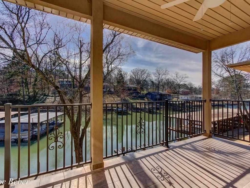 LAKE HAMILTON WATERFRONT CONDO!  Wood Floors, 9 Ft. Ceilings, Crown, my Granite, Glass Tile Backsplashes, Beautiful Cabinetry, Stainless Appliances - All done to Magazine Perfection! Pella Widows & French Doors Lead to Outdoor Living on Your Private Covered Balcony with Beautiful Lake Views.  Open Concept Living with Breakfast Bar, Dining Area & Spacious Living Room. Private Boat Ramp & Tie-Ups.