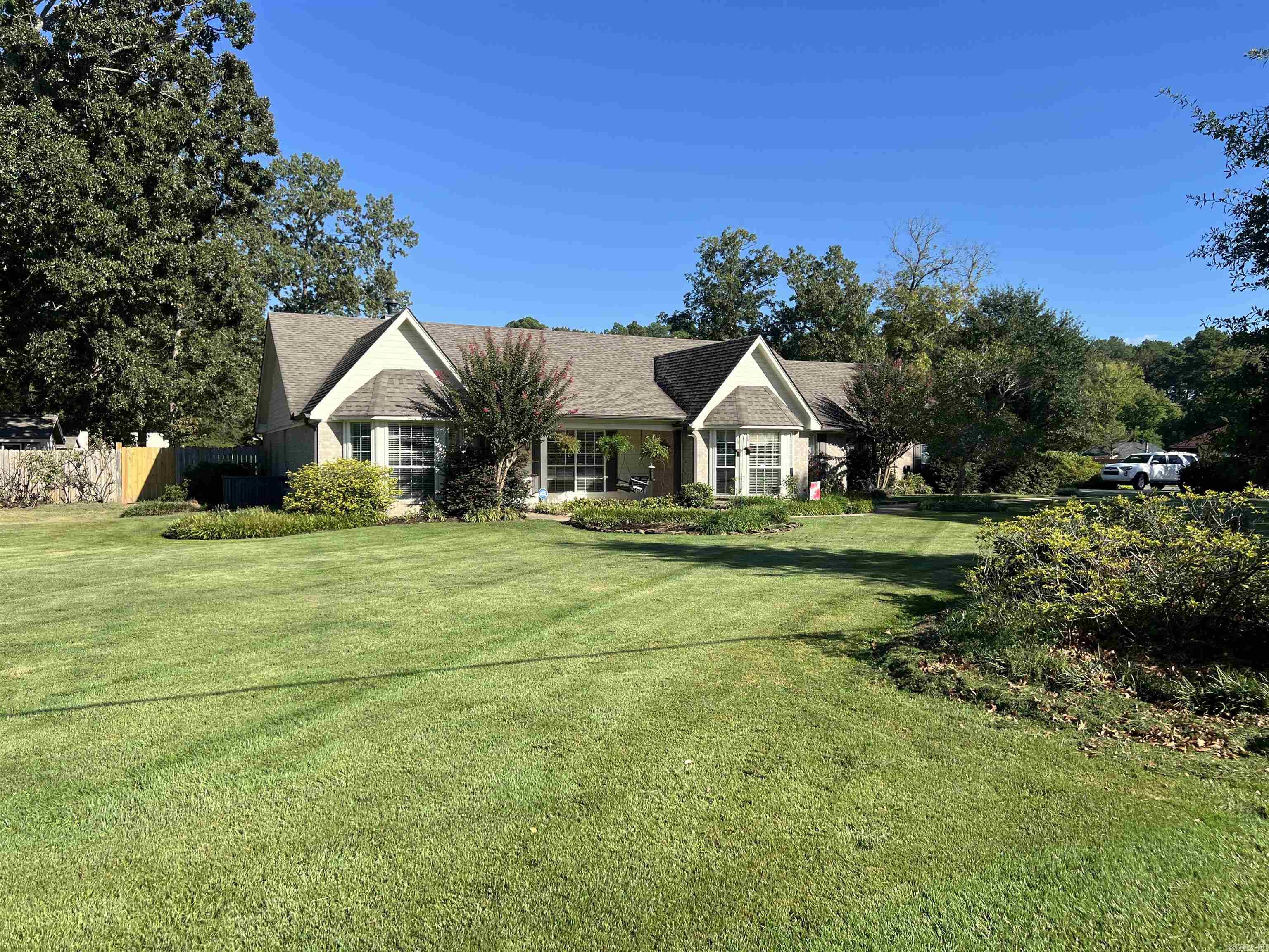 mmaculately maintained and custom built, this beautiful one-owner three-bedroom, two-bath brick home sits on almost an acre corner lot and is truly move-in ready. The backyard is a private oasis featuring a sparkling 18x36 swimming pool, pergola, extra landscaping, a 12x16 shop, and a fully fenced yard with in-ground irrigation. Recent updates include new gutters, a newer roof, and a 30-amp outlet ready for a generator (not included). Inside, you’ll find a split floor plan with a spacious living room highlighted by tray ceilings, a cozy wood-burning fireplace, and newer hardwood floors. The large master suite offers a garden tub, separate shower, and generous closet space, while the two spare bedrooms are nicely sized. The updated kitchen is a chef’s dream with granite countertops, abundant cabinetry, stainless steel appliances including a double oven gas cookstove, under-cabinet lighting, and a breakfast bar that flows into the dining area. A bonus room, currently used as an office, could easily serve as a fourth bedroom if needed.This home combines thoughtful updates with timeless charm and has everything you need for both comfort and entertaining.