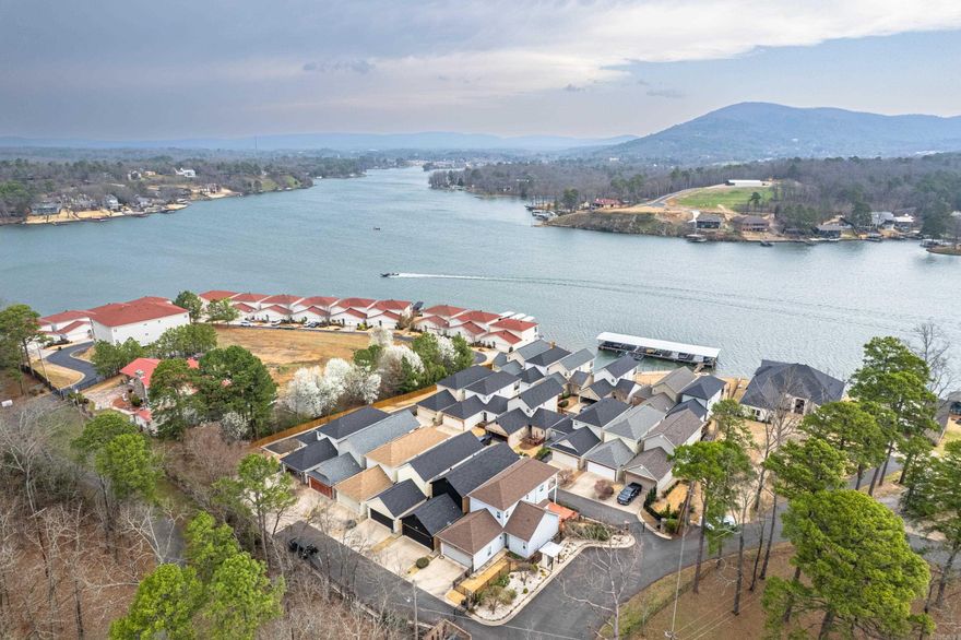 Are you in search of a beautiful townhome with Lake Hamilton access that is close to the bypass, shopping, medical offices, and restaurants? If so, you have hit the jackpot! This townhome requires very little maintenance and upkeep. Sit on either upper or lower balcony and enjoy conversations and beverages of your choosing. Don't wait and miss out on this showcase.