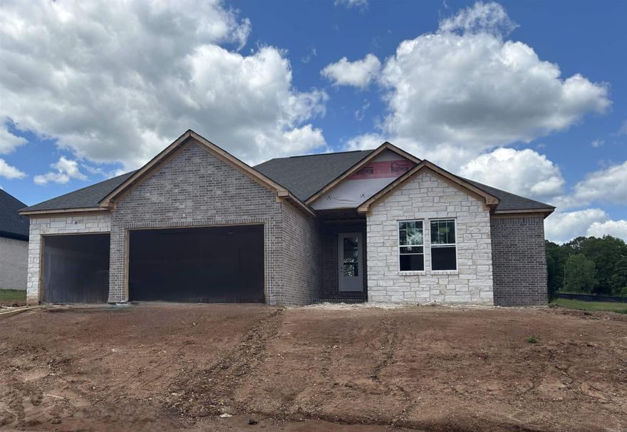 THREE CAR GARAGE!!! Large covered back porch, extra landscaping. LVP flooring , custom cabinets with large island, wall oven, gas cooktop. butler pantry, also regular pantry. Primary has tile shower with separate tub, large closet.