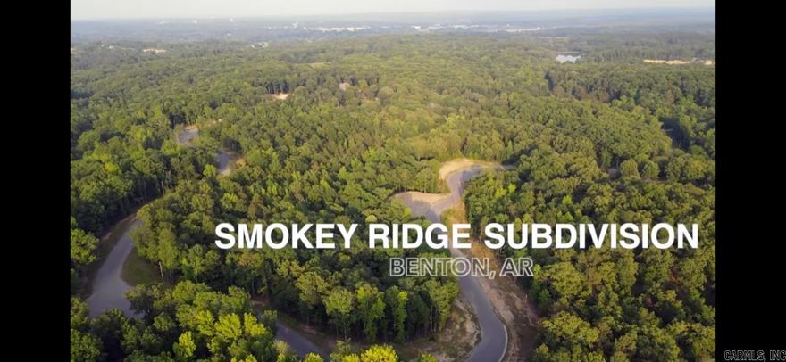 Smokey Ridge Subdivision has secluded lots nestled among mature hardwood trees with blooming Dogwoods. One of the highest points in Saline Co with rolling hills gives way to scenic views.  Subdivision is adjacent to the AR Natural Heritage Preserve area with hiking trails to the river. 1-3 acre lots.  Private single entrance.  City water with fiber internet.  Benton's newest elementary and middle schools nearby.  Pick your lot and start building your dream home today.  Exit 114 to W. Jackman Trail to Johnson to Smokey Ridge Rd.