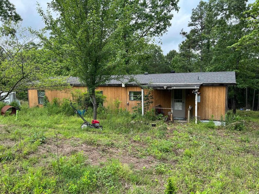 9.95 acres with older mobile home.  Has a good roof on it  Make fair offer