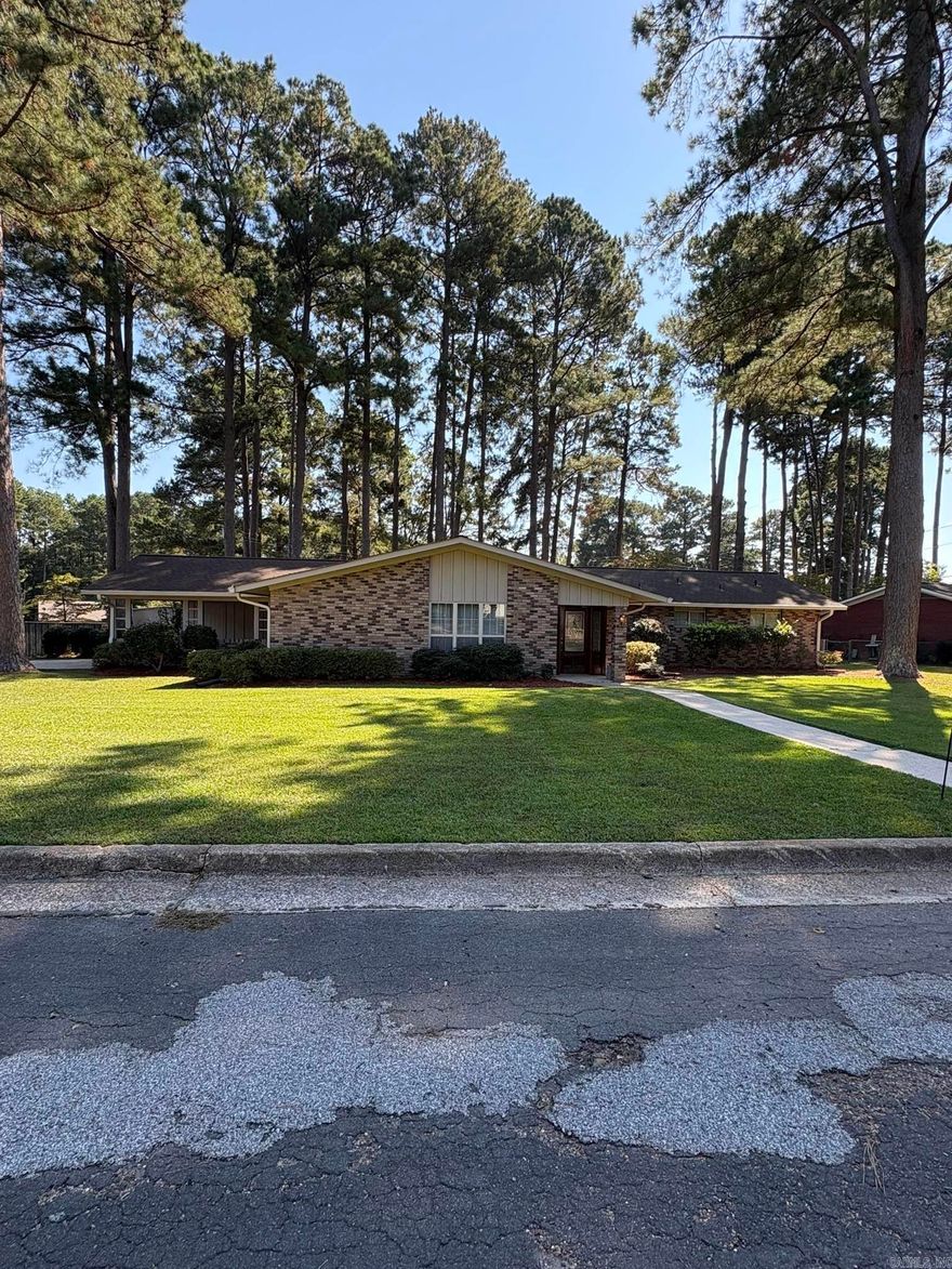 Welcome to this beautiful 4-bedroom, 3-bath brick home offering nearly 3,000 sq. ft. of comfortable living space. Located in a highly sought-after subdivision, this property features a double carport, wood privacy fence, and a large wood deck—perfect for entertaining or relaxing outdoors. Inside, you’ll find a warm and inviting family room with a cozy fireplace with built-ins on each side and sliding glass doors, as well as a second fireplace in the primary bedroom for those quiet, relaxing evenings. The layout provides plenty of space for family and guests, with generous room sizes and thoughtful details throughout. Sliding glass doors lead out on to the large wooden deck to overlook the backyard.  There is a bonus room at the front of the house that can be used as a dining room or living room.  Two primary suites, one of which has a fireplace.  There are 2 water heaters and central heating/air units.  A storage building offers extra space for tools or hobbies, adding convenience to this already well-appointed home. Don’t miss your opportunity to make this spacious and charming property yours!