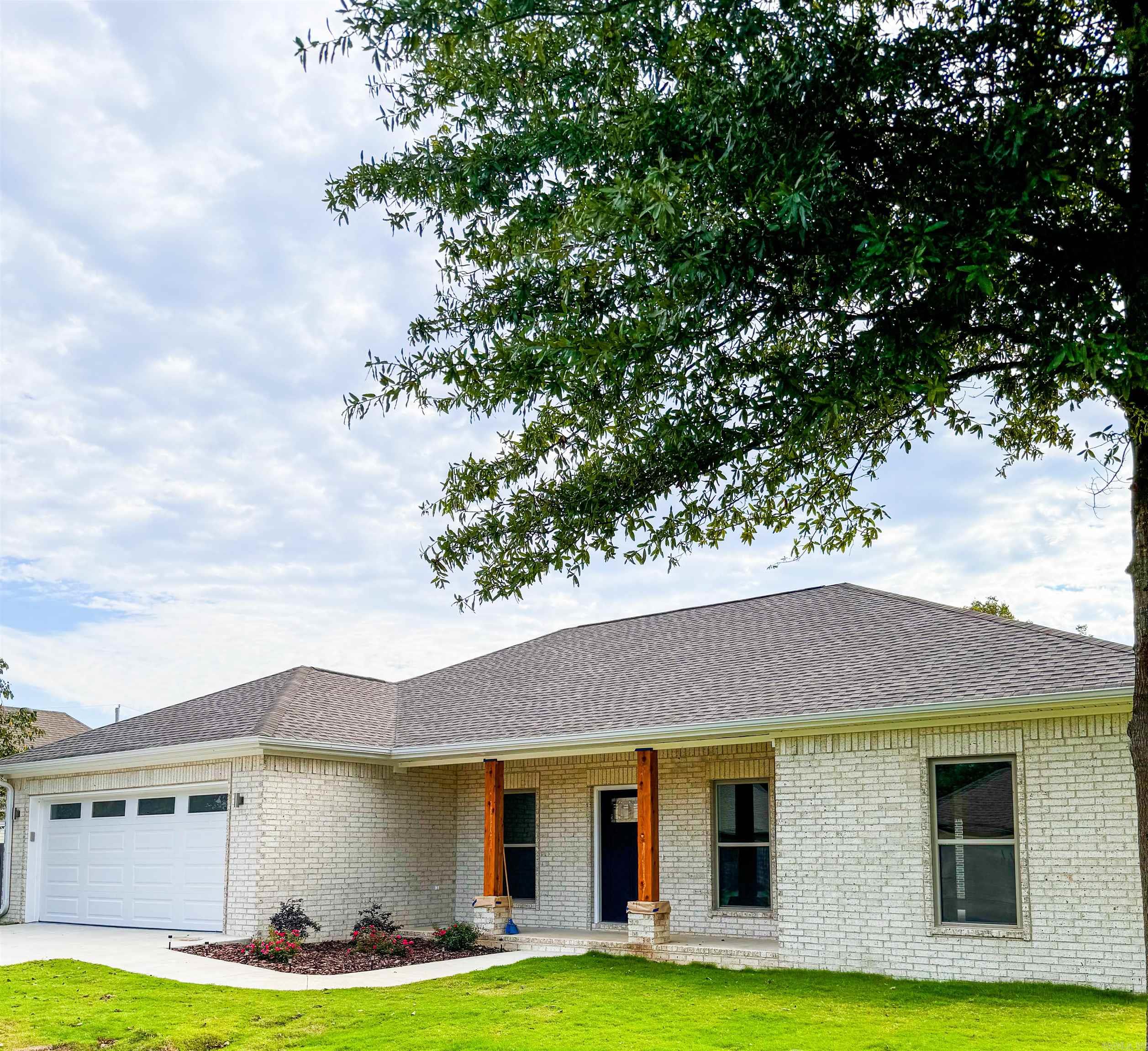 Beautiful 3-Bedroom, 2-Bathroom Home! Discover the perfect blend of style and comfort in this 1,760 sq. ft. all-electric home featuring 9-foot ceilings and a desirable split bedroom floor plan. The kitchen is a chef's dream with granite countertops and stainless steel appliances, while the entire home is fitted with luxury waterproof laminate flooring for a modern, durable finish. Retreat to the spacious master suite, complete with a separate luxurious tiled walk in shower, soaking tub with another shower and a private toilet room, all accented by double sinks for added convenience. With the split bedroom design the additional two bedrooms are on the opposite side of the home, offering privacy and convenience for guests or family. This property boasts all brick construction, a two-car garage with insulated doors, and a landscaped yard adorned with solar lights and cedar posts. The roof has architectural shingles, front-facing long windows for a beautiful touch and a covered backyard patio make this home a standout. Exterior porch lights surround the home, with backyard security lights for added peace of mind.