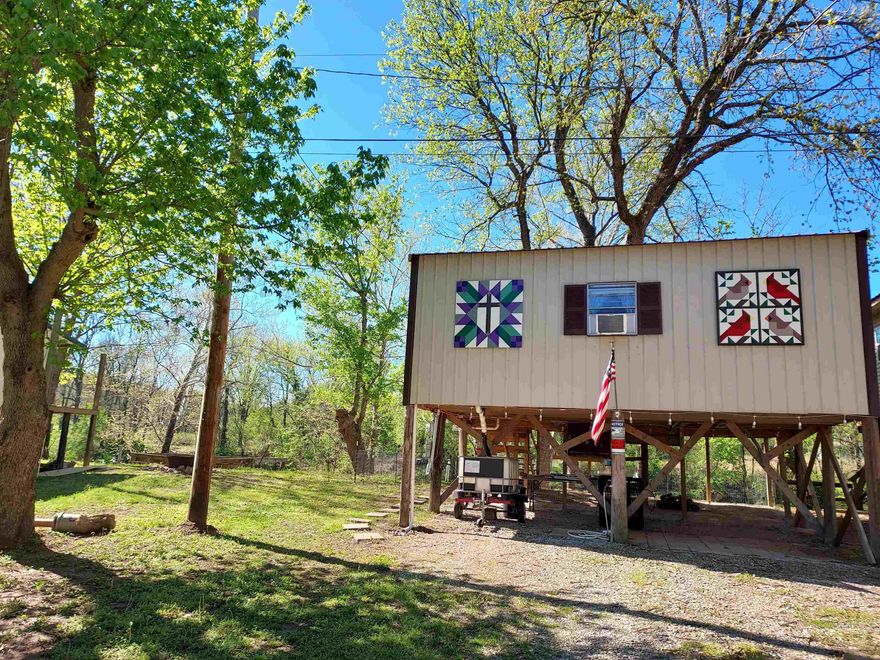 Riverfront cabin on Spring River  Nestled on the banks of the Spring River in Northern Arkansas, this charming 1-bedroom, 1-bath waterfront cabin is a fantastic opportunity for those who love outdoor activities. Situated on a 40x200 lot with 40 feet of prime river frontage, this recreational property is a dream for fishing, canoeing, and kayaking.  Enjoy the screened-in riverfront porch overlooking the serene Spring River. The kitchen comes equipped with a cooktop, refrigerator, and is ready for your weekend getaways. The cabin also features a deck, a covered front porch, and sitting areas at the river's edge, complete with concrete steps leading into the water. RV hook up available also. Close to Ravenden Public access to the Spring River, this location offers easy in-and-out boat landing for all your river fishing and recreational needs.  Enjoy the stunning views of the river and the peaceful sights of the cattle farm behind the property. Conveniently located just 15 min. from Hardy, AR, and a short drive to the Black River, Eleven Point River, and Lake Charles, you're only an hour from Jbo. This cabin is perfect for anyone looking to escape City life. This one won't last long.