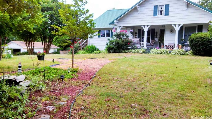 Country living at its absolute best! Super property, just 6 miles from Ash Flat, in Evening Shade. Charming home sits on 3 beautiful ACRES m/l. Small gazing pond w/water fountain. 3 bdrm 1 ba upstairs. Lower level is approx. 75% finished. There's nearly a 2nd home dwnstrs including 2nd bath. Super Country kitchen w/island w/elec & prep sink. Huge knotty pine Dining room! Large living rm w/wood stove, Cent, gas heat, Train air new in 2010, water softener, new pressure tank, deck, porch detached garage. #2012