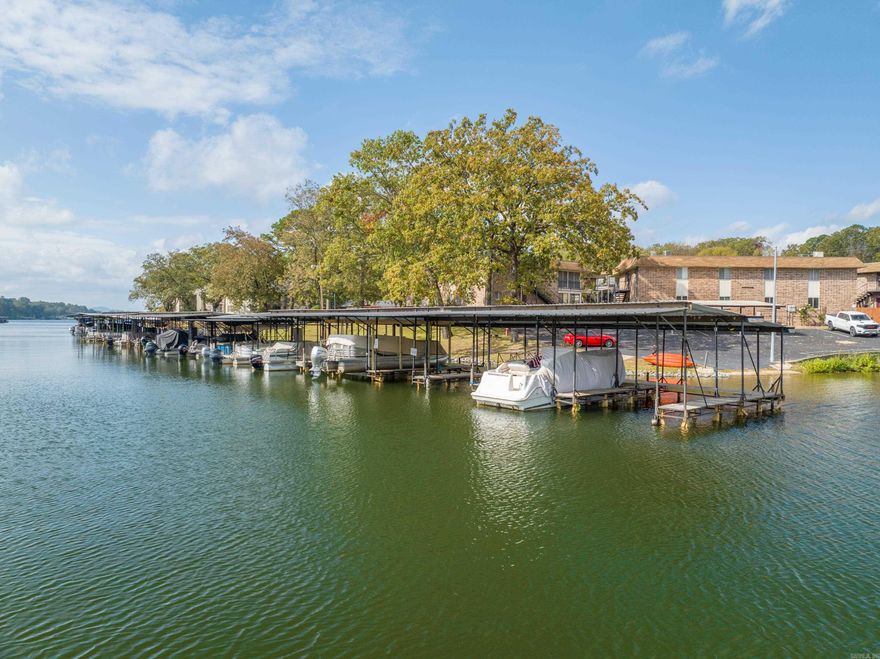 Unheard of at this price! Two bedroom-two bath upper level condo with covered boat slip. Racetrack and casino close by. Totally updated and decorated. Furnishings convey. Three month minimum rentals allowed. Unit overlooks pool and well-manicured lawn. Boat dock just a few steps away. Located straight across lake from Sam's Pizza Pub. Unit is agent owned.