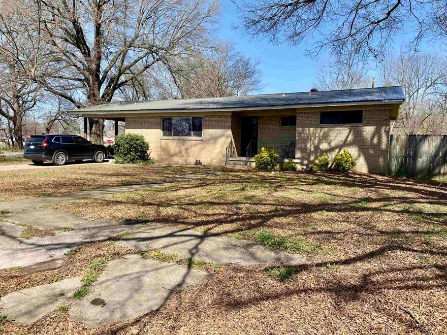 3 bedroom 2 bath home offering 1,707 sq ft of comfortable living space on a spacious corner lot. Features a living and dining combo open to the kitchen, creating a functional layout for everyday living. Kitchen includes a convenient laundry area. Some windows have been updated for improved efficiency and natural light.   Master bathroom features a jacuzzi bathtub. Additional highlights include a large bonus family room, screened in back porch, and a large fully fenced backyard.  The property also includes a 24x24 shop building with a fenced in garage and attached screened in porch, ideal for storage, hobbies, or workspace.   Located approximately 25 minutes from Jonesboro and near Stewart Park and the Lawrence County School District.