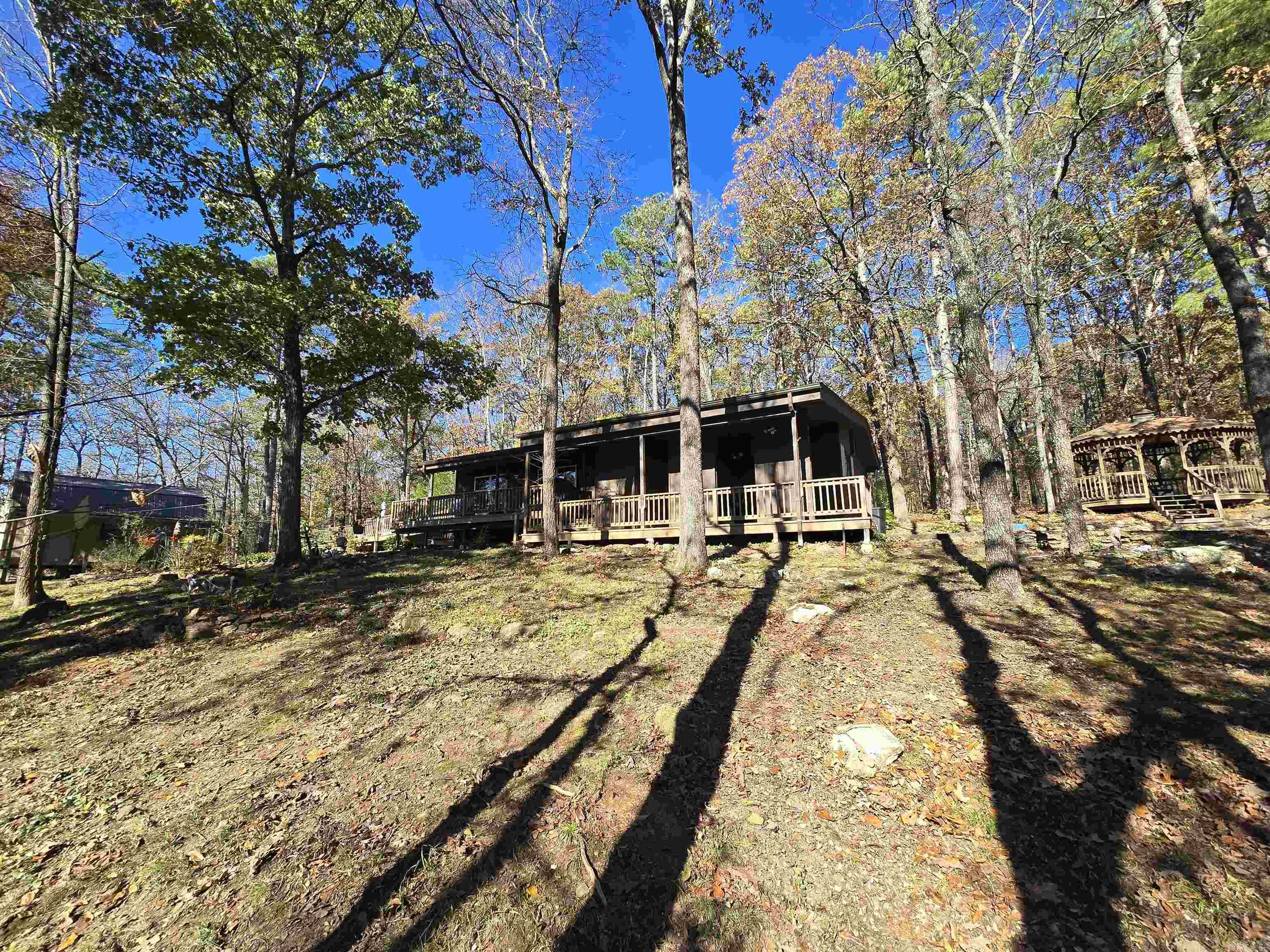 Truly a hidden gem right in the heart of Indian Hills. Tucked away in trees and surrounded by forest yet a just a short golf cart ride from the course. This one is one of a kind. Offering beautiful views outside every window of the abundant wildlife. Tons of private, outdoor entertaining space and even a small raised bed greenhouse. Updated with new kitchen appliances, upgraded cabinets and countertops, bathroom, and fixtures throughout. This rare property even features a 24"x14" heated and cooled workshop with loft and large covered porch. This is also one the few homes in FFB to have monthly dues of only $113. Come take a look at this one before it's gone, you won't find another like it.