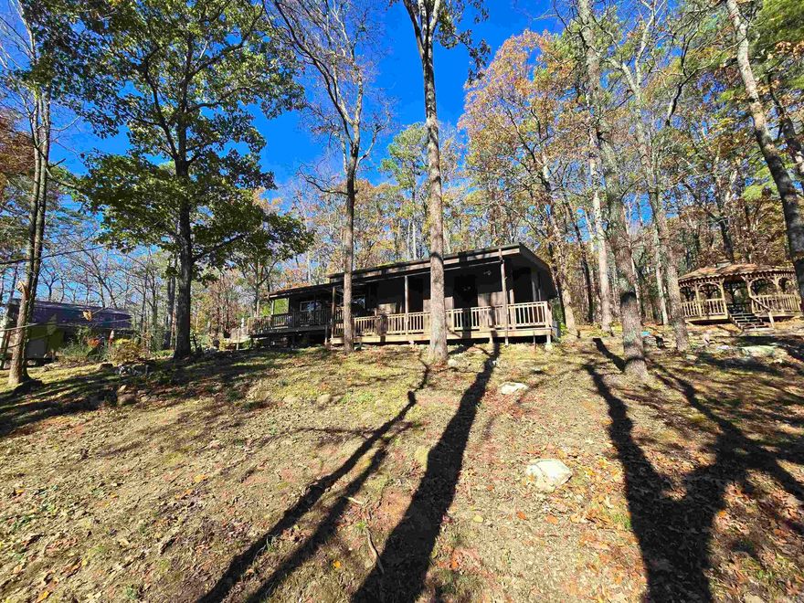 Truly a hidden gem right in the heart of Indian Hills.  Tucked away in trees and surrounded by forest yet a just a short golf cart ride from the course.  This one is one of a kind.  Offering beautiful views outside every window of the abundant wildlife.  Tons of private, outdoor entertaining space and even a small raised bed greenhouse.  Updated with new kitchen appliances, upgraded cabinets and countertops, bathroom, and fixtures throughout.  This rare property even features a 24"x14" heated and cooled workshop with loft and large covered porch.  This is also one the few homes in FFB to have monthly dues of only $113. Come take a look at this one before it's gone, you won't find another like it.