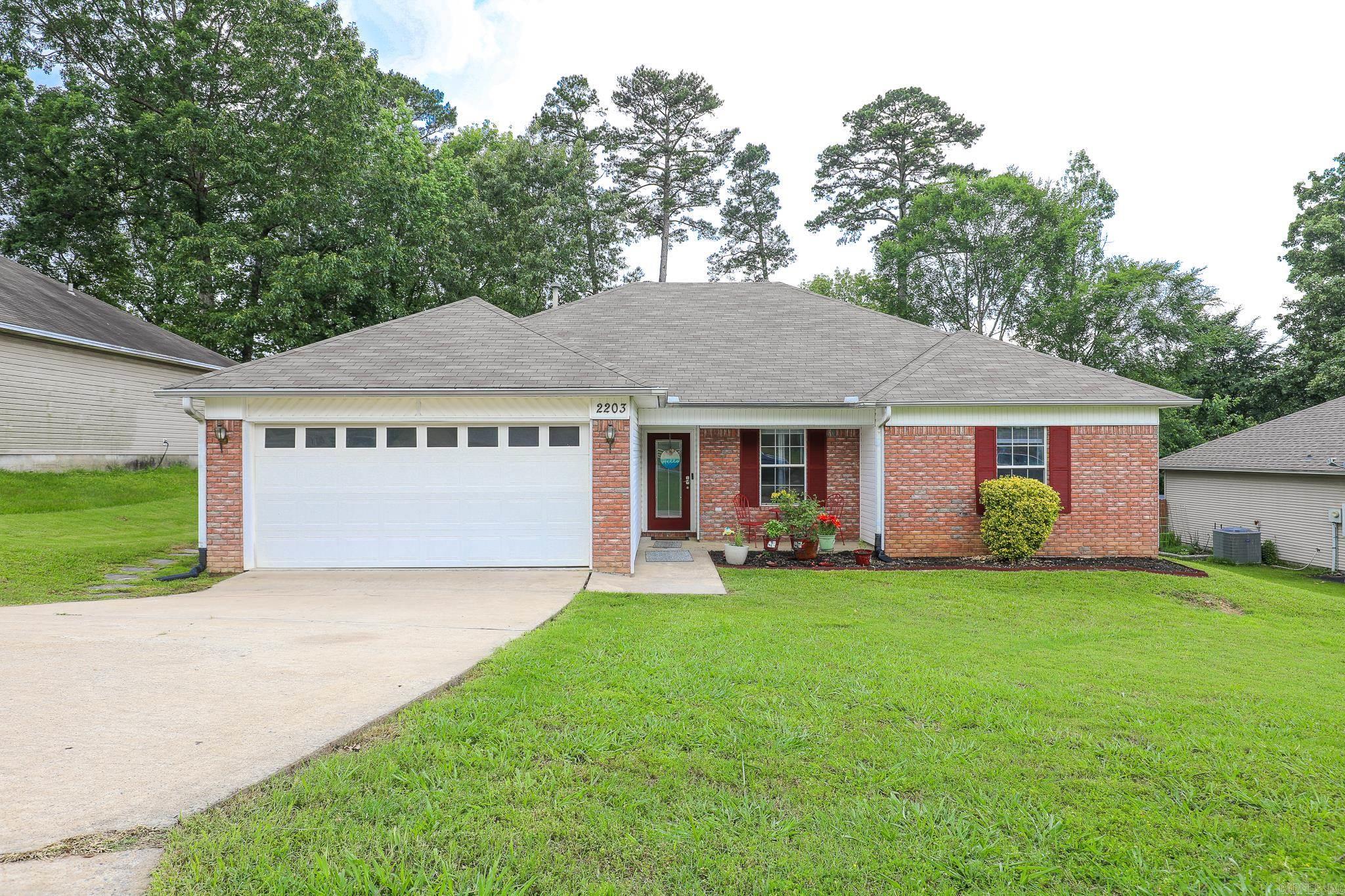 This charming 4-bedroom, 2-bath home offers the perfect blend of comfort, space, and outdoor fun. Step inside to find an inviting living area and a well-appointed kitchen with plenty of cabinet space. Updates include fresh paint and new flooring in 2024. The primary suite has it's own entrance onto the back deck and has a private bathroom and walk-in closet. Outside, you'll love the fenced in backyard complete with a patio and an above-ground pool —perfect for cooling off on warm summer days or hosting weekend gatherings. This home is in a great location convenient to shopping, dining, and I-30 for easy commuting. Bryant School District. Motivated Seller! AGENTS SEE REMARKS