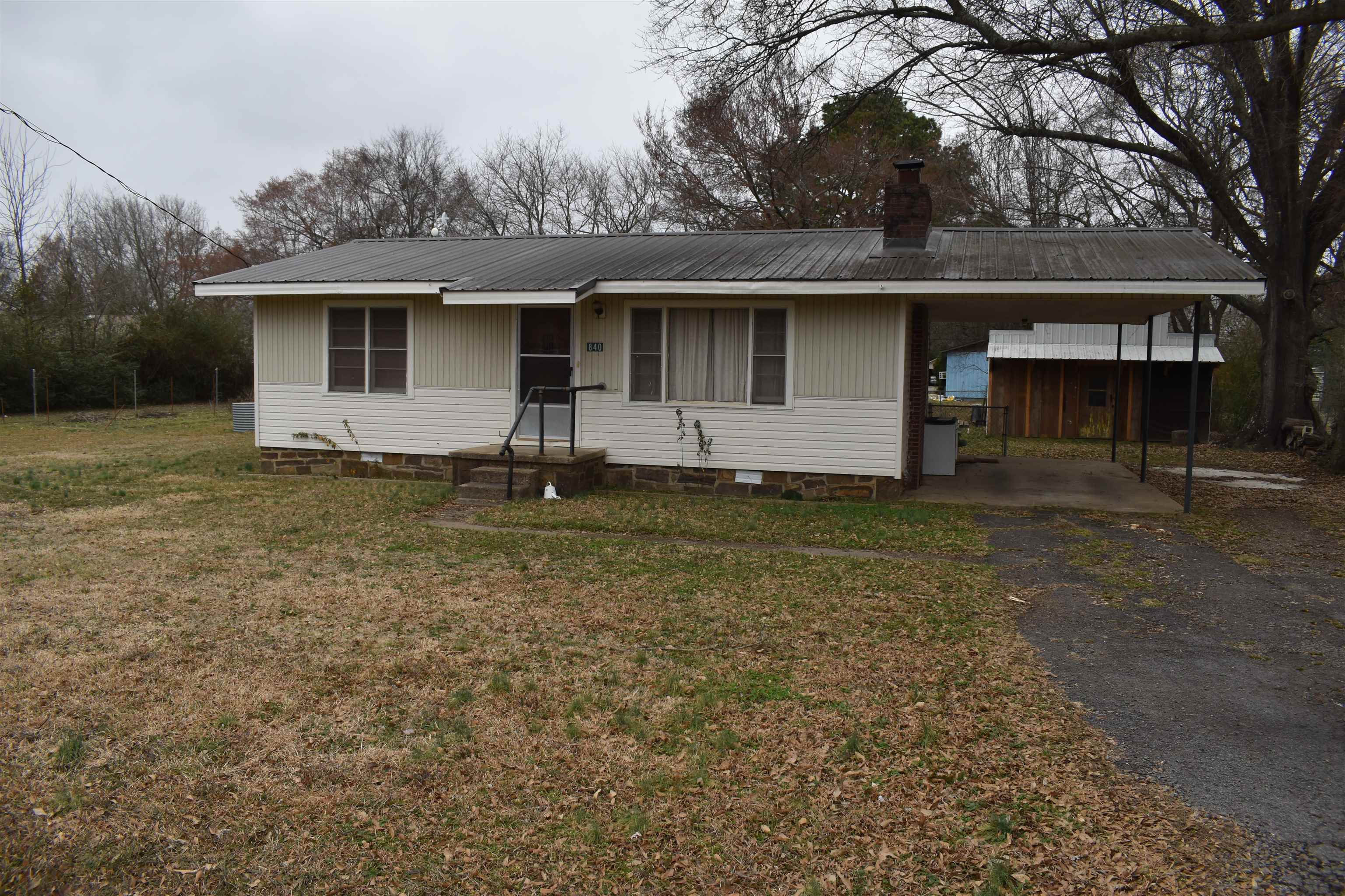 MOTIVATED SELLERS! Located in Waldron, this great starter home is ready for its new owner! Located in a great location, just minutes from the city park as well as the Boys & Girls Club. The home is 884 square feet, with a covered front porch and a carport. Two Bedrooms and one full bath as well as a eat in kitchen and a living area compose the floor plan of this home. Outside, three city lots make for an excellent front and back yard, giving plenty of room for gardening and entertaining family and friends. A workshop in the back yard is covered with shade from towering oak trees. With all of the great conveniences of town, this home is ready for its new owner.