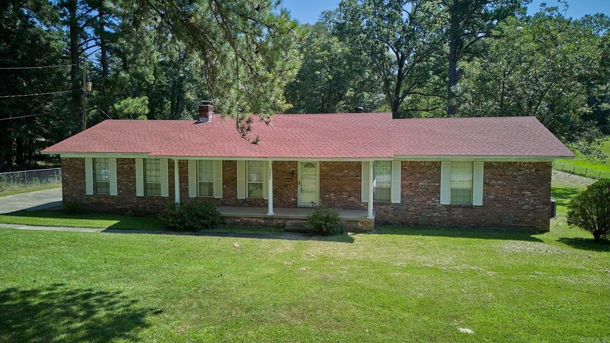 Great little house in the country! Home sits on fenced 1 acre and includes a workshop in the backyard. Three bed/two bath older home with great space and storage. Living room and den area. Kitchen features updated appliances, island area with an eat-in dining room. Wood burning fireplace, large separate laundry, large covered wood deck. Home needs a little updating. Being sold "AS-IS".