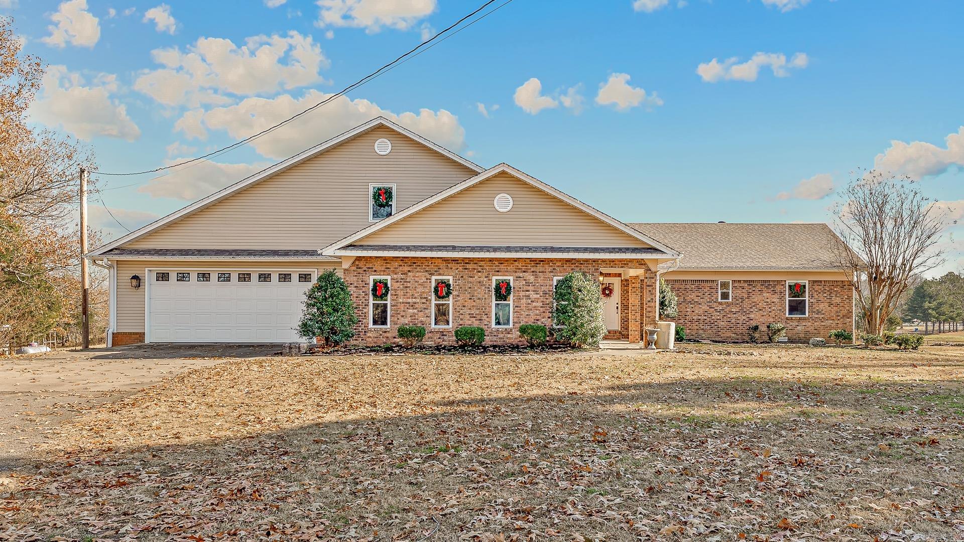 Welcome to this exceptional 10+ acre mini-ranch, perfectly located within the city limits, offering the rare combination of luxury, privacy, and functionality. Accessed through a gated entrance, this property is designed for those seeking a rural lifestyle with all the conveniences of city living.  6-Stall Horse Barn: Ideal for equestrians, with plenty of space for your horses or livestock.  Two Ponds: Gorgeous water features that add beauty and tranquility to the landscape.  Large Shop: A versatile space with 3 overhead doorsperfect for equipment storage, hobbies, or a home business. This stunning home has been fully remodeled, blending modern comfort with timeless charm. Inside, you'll find a Chef's Dream Kitchen: Custom cabinetry, top-of-the-line appliances, and an expansive island make it perfect for culinary enthusiasts.Prep Kitchen/Pantry: A spacious, dedicated area for meal prep and storage.  4 Bedrooms & 3 Full Baths: Generously sized rooms with luxurious finishes throughout.  Tiled Dog Bath & Utility Sink: Thoughtfully designed for pet owners Storm Shelter: Peace of mind during severe weather.Inground Pool: Enjoy the outdoors with an updated pool liner and filter.  Updated