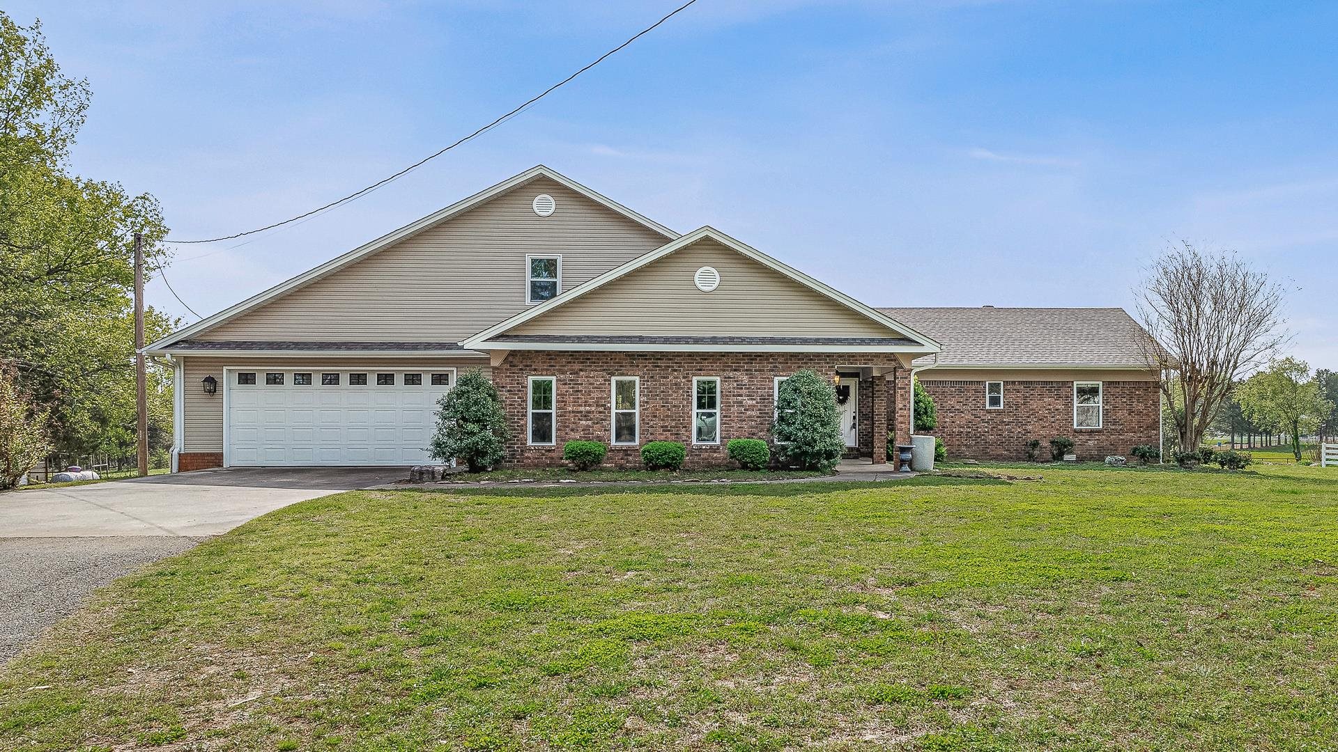 Welcome to this exceptional 10+ acre mini-ranch, perfectly located within the city limits, offering the rare combination of luxury, privacy, and functionality. Accessed through a gated entrance, this property is designed for those seeking a rural lifestyle with all the conveniences of city living. 6-Stall Horse Barn: Ideal for equestrians, with plenty of space for your horses or livestock. Two Ponds: Gorgeous water features that add beauty and tranquility to the landscape. Large Shop: A versatile space with 3 overhead doorsperfect for equipment storage, hobbies, or a home business. This stunning home has been fully remodeled, blending modern comfort with timeless charm. Inside, you'll find a Chef's Dream Kitchen: Custom cabinetry, top-of-the-line appliances, and an expansive island make it perfect for culinary enthusiasts.Prep Kitchen/Pantry: A spacious, dedicated area for meal prep and storage. 4 Bedrooms & 3 Full Baths: Generously sized rooms with luxurious finishes throughout. Tiled Dog Bath & Utility Sink: Thoughtfully designed for pet owners Storm Shelter: Peace of mind during severe weather.Inground Pool: Enjoy the outdoors with an updated pool liner and filter. Updated