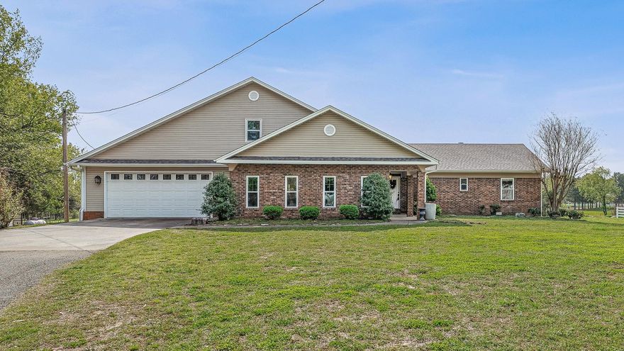 Welcome to this exceptional 10+ acre mini-ranch, perfectly located within the city limits, offering the rare combination of luxury, privacy, and functionality. Accessed through a gated entrance, this property is designed for those seeking a rural lifestyle with all the conveniences of city living.  6-Stall Horse Barn: Ideal for equestrians, with plenty of space for your horses or livestock.  Two Ponds: Gorgeous water features that add beauty and tranquility to the landscape.  Large Shop: A versatile space with 3 overhead doorsperfect for equipment storage, hobbies, or a home business. This stunning home has been fully remodeled, blending modern comfort with timeless charm. Inside, you'll find a Chef's Dream Kitchen: Custom cabinetry, top-of-the-line appliances, and an expansive island make it perfect for culinary enthusiasts.Prep Kitchen/Pantry: A spacious, dedicated area for meal prep and storage.  4 Bedrooms & 3 Full Baths: Generously sized rooms with luxurious finishes throughout.  Tiled Dog Bath & Utility Sink: Thoughtfully designed for pet owners Storm Shelter: Peace of mind during severe weather.Inground Pool: Enjoy the outdoors with an updated pool liner and filter.  Updated