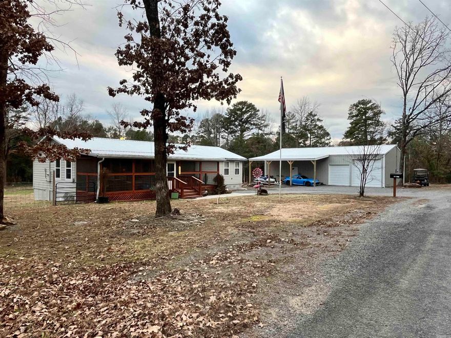 LOCATION, LOCATION, LOCATION!!! No need to pay hundreds or thousands for a boat slip when you can launch your boat in your own neighborhood for free! The huge shop with a drive through option for your boat is perfection at it's best! It's a 3 minute walk (or 1 minute golf cart ride) and a perfect place to watch the sunset! Come check out this amazing, updated, welcoming cabin perfect for your new home by Greer's Ferry Lake! The kitchen has been updated with granite countertops and all new appliances! All of the wood accents create coziness and charm! The huge primary bedroom creates a haven for relaxation. Enjoy time on the screened in front porch or the back deck, relaxing or entertaining! Welcome Home to Lake Life at your spectacular Lake Cabin on 1.5 acres! Zillow has made their own twist saying there is a boat slip, but there is not! There is a neighborhood boat launch oh so close to the cabin!!!