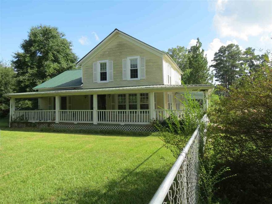 Large home on fenced corner lot.  Wrap around porch on 3 sides, back deck.  This home has lots of charm and needs a little tlc to make it shine!  The master bedroom is downstairs, 2 bedrooms upstairs that have been opened up to one.  Walk in attic that is floored, could be finished out for another room.  Call today for your personal tour.