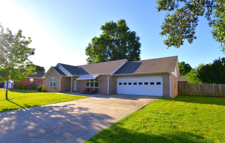 Beautiful all-brick home offering over 2,276 sq ft in a convenient location with numerous updates and flexible living space. The spacious backyard is fully enclosed with a wood privacy fence and features a mature shade tree, a wired enclosed garden planted for summer vegetables, and a covered patio for relaxing, grilling and entertaining. The gutters are all buried drains that direct water away from the home to the street. Major updates completed in 2022 include a new roof, updated flooring in the hall and living room, all new front windows, a new entry door, new exterior door, and a new master bathroom window. The kitchen features custom cabinetry, pull-out pantry shelves, granite countertops, a farmhouse sink, and all kitchen appliances convey. Interior rooms feature ceiling fans and dimmer light switches throughout. The bonus room, added during the installation of the one-room basement, offers versatile space for a game room, office, exercise room, and has access to the patio. The basement is a registered storm shelter is currently used as a theater room. The wide stairway from the bonus room to the basement creates an open, spacious feel. Schedule a showing and check it out!