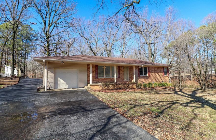 2.4 acres surround this well maintained one owner brick home just outside the Jonesboro city limits. Remodeled kitchen with granite countertops, newer appliances including refrigerator, breakfast bar and custom white cabinets. Formal living/dining room, cozy den with wood beams, brick wall and gas fireplace complete the two main living areas. Plus an additional sunroom enclosed with beautiful windows for a view of the over two acre backyard. A bedroom wall has been removed to make an extra large main bedroom but could be reinstalled to make a three bedroom home if needed. Both bathrooms are spacious and updated. 24 X 24 (approximately) shop building with electricity.