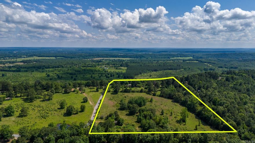 Mostly cleared land with some large trees. Sits along a ridge, with some clearing along the back of the property the view would be amazing. This is the perfect spot if you wanted to have horses or other livestock. Power and water on the property. Several great locations to build a home. No restrictions. Road on 2 sides of the property.