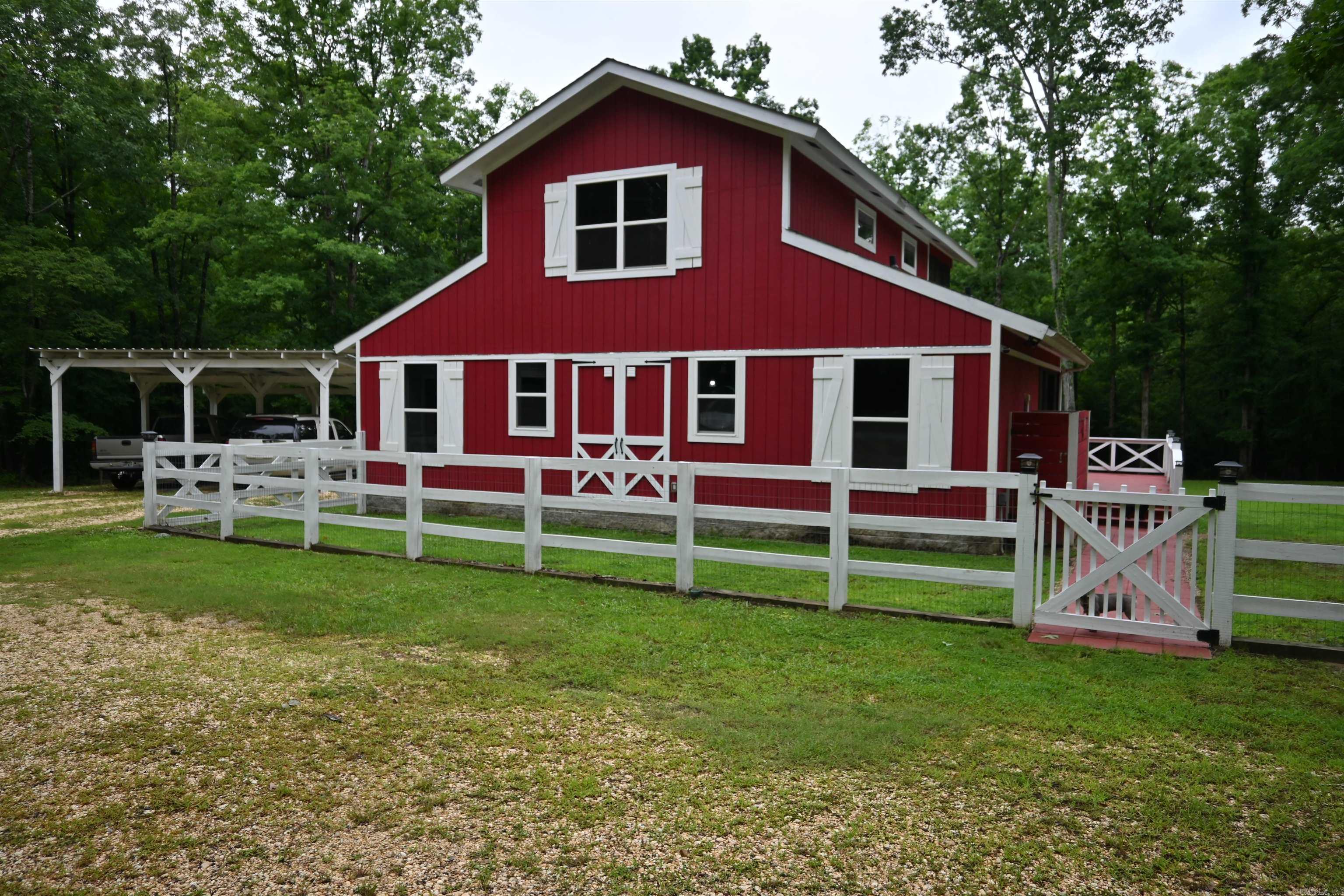 You better leap on this one before its gone*2BR*1-1/2BA*1552 sq ft*25+-acres*beautiful kitchen w/ Induction Stove*SS appliances*Custom Epoxy Countertops throughout the home*large glass doors for looking over the property*several screened in porches for enjoying the outdoors*all doors are custom built to fit the style of the home*mini-splits upstairs and downstairs*master bedroom & bathroom upstairs*large walk-in closet*screened in balcony off master bedroom*large pantry room with custom pull outs shelves*spacious laundry room*lots of closets*all ceilings are uniquely designed per room*1600 sq ft Shop/Barn*Chicken Coop w/ automatic waters from (2) cisterns and automatic feeder for the coop*several open sheds for storage of firewood and outdoor equipment*beautiful creek runs on the property with mowed trails for walking*video surveillance*gated driveway w/ a delivery box for your packages*All of this located in Grant County and in the Sheridan School District*PRE-APPROVAL IS A MUST*
