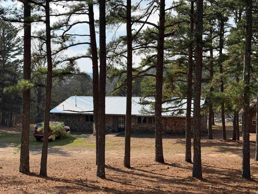 Your Ozarks retreat awaits at 1681 Oxley Road, Leslie, AR! This 2,400 +/- sq ft home features an open living/kitchen area, three bedrooms, two baths, and bonus space. On 10.12 +/- surveyed acres, enjoy rock outcroppings, bluffs, caves, a spring, and direct access to the Stem Rock Natural Area. A small outbuilding provides storage. Conveniently located on a paved county road, this property blends modern living with nature’s beauty—don’t miss out!