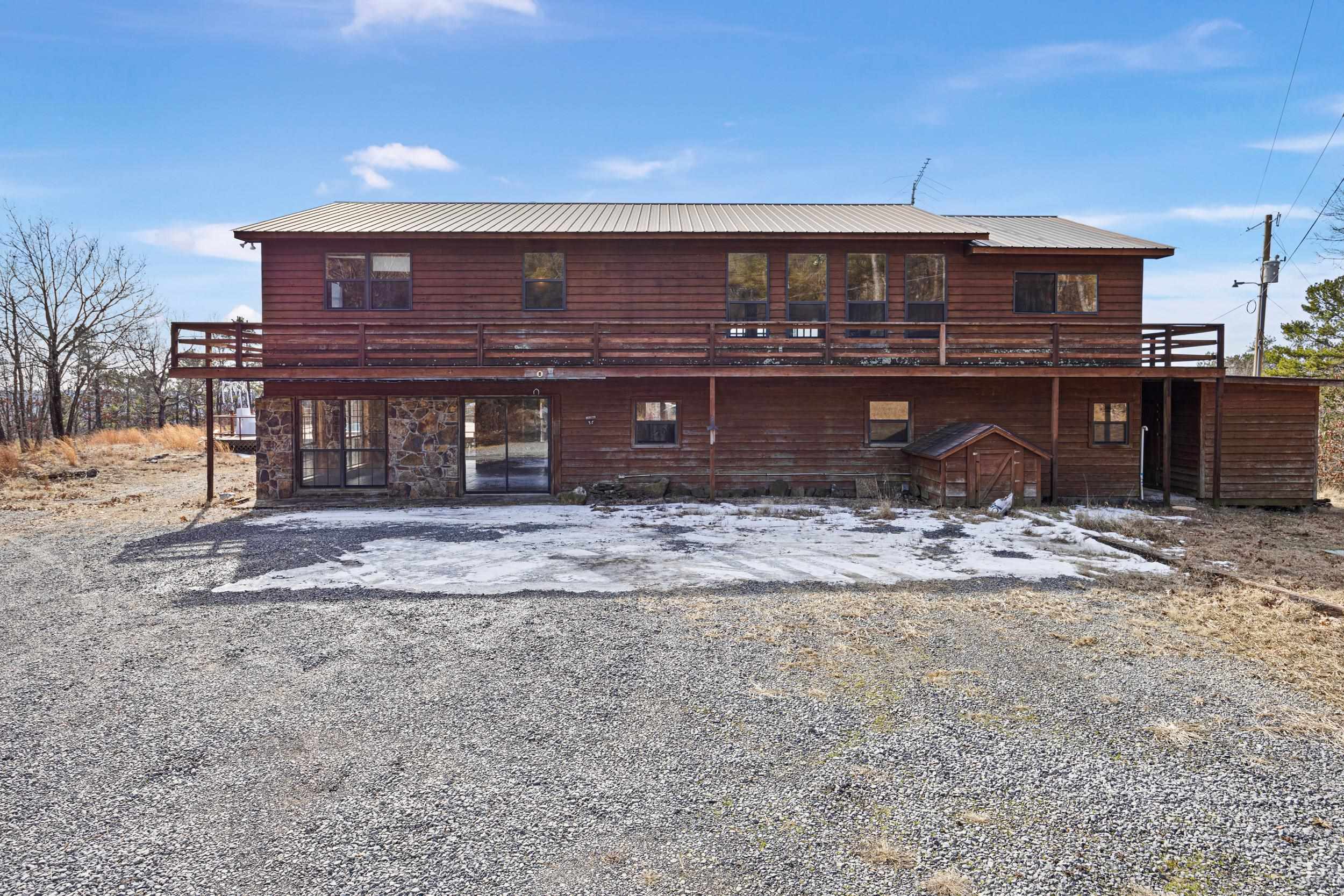 Here is your opportunity to own a beautiful home with a breathtaking mountain view. Sitting on almost 5 acres, this spacious 2-story home offers plenty of room for entertainment and relaxation, with a large deck built around the above-ground pool. On the first level, you will find a large sunroom connected to the perfect space for entertaining your guests, two storage closets, two additional rooms that can be used as office space, and a bathroom. There are two flights of stairs leading to the kitchen or living room on the second story, where you will be greeted with a breathtaking view of the mountains. Upstairs features 3 bedrooms, 2 full baths, and a gorgeous wood-burning stove. This home is truly one of a kind, offering tremendous peace and tranquility because of its location.