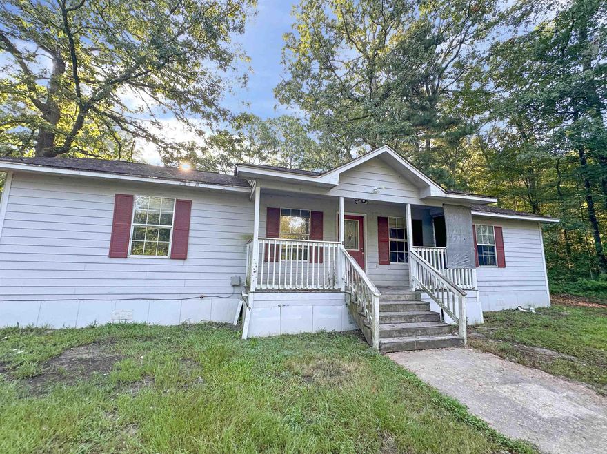 Come check out this 4 bedroom 2 bath home in clearwater estates! Covered front porch and  located on a large corner lot. Enjoy fishing and sitting by the lake that only property owners in the subdivision can access. Sold  AS IS. AGENTS SEE REMARKS.