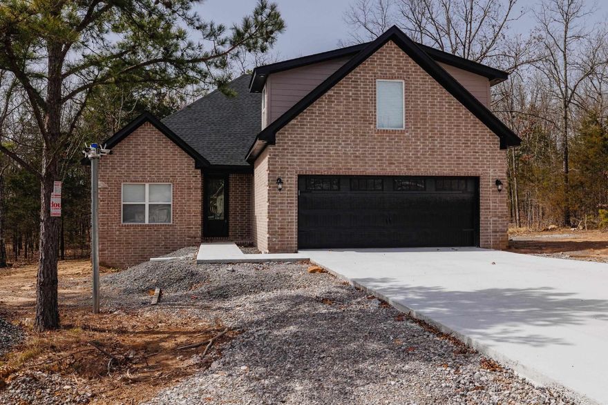 TAKE A CLOSER LOOK! This 3-bedroom, 3-bathroom home in Hawks Point is programmed for ENTERTAINMENT! Love LAKE LIVING? This floor plan is GREAT! Living room and kitchen is an open concept floor plan with lots of windows to bring in the natural light. Speaking of kitchens, this one offers well-lit workspace, an island, quartz counters and stainless appliances. 2 bedrooms and 2 FULL bathrooms on the main floor with an additional bedroom OR bonus room on the second floor that includes another full bath. Main floor primary suite with bath is tucked away and features a walk-in closet, double vanities, a tile shower and bathtub. This new construction home is within minutes of Hill Creek Marina. CALL TODAY and enjoy your new address ALL SUMMER LONG!