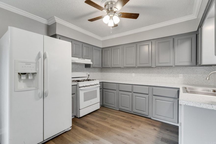 COMPLETELY REMODELED home, with TONS of updates, including new luxury vinyl flooring throughout, new paint, cabinetry and counter-tops, a NEW extended parking pad, and so much more! This beauty offers a large kitchen/dining combo, a spacious living room, updated bathrooms, and a fenced backyard. Seller concessions offered. MUST SEE!!!