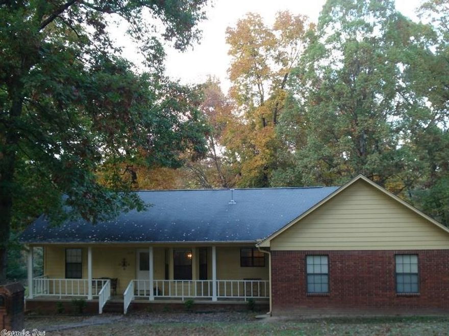 One level brick on two corner lots for .68 acres total. Quiet outdoor living with covered front porch and large back deck overlooking private park like yard. Hardwoods and pergo flooring, surround sound and central vac system. Large vaulted den with full masonry brick fireplace. Newer paint, 2009 HWH and 2011 HVAC. Side load garage, large utility room, office desk with built-ins and 10x12 storage unit. Quality built on quiet street.